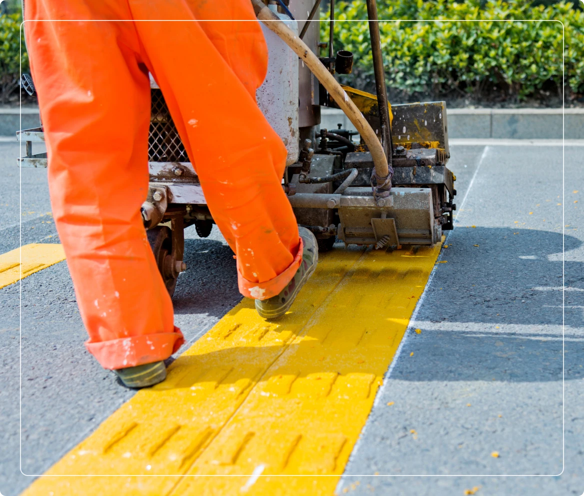 Road marking with yellow paint machine